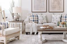 a living room filled with furniture next to two pictures on the wall and paintings above them