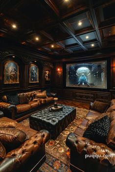 a living room with leather couches and a large screen