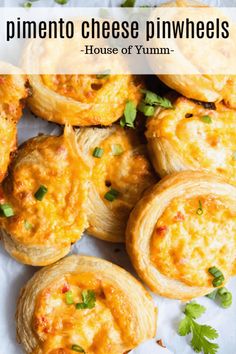 mini cheese pinwheels with parsley on top and text overlay that reads pinenut cheese pinwheels house of yum