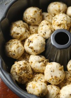 some kind of food that is in a pot on the table and ready to be cooked