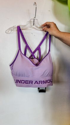 This bra gives you the right support for low-impact activities. It has a longer cut, seamless fit, and adjustable straps for complete comfort. Delivers strategic support, tailored for low-impact activities like yoga, pilates & hiking UA Seamless is a soft knit with engineered ventilation, mapped to the places you need it most Soft, removable cups for enhanced shape & coverage Skinny strap pullover with adjustable cross back design Wide jacquard wordmark band for amazing stretch & comfort Materia Long Sports Bra, Purple Gifts, Dress Mules, Rust Sweater, Rebecca Black, Black Rain Jacket, Hot Pink Leopard, Western Style Outfits, Nature Dress