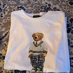 New Men’s Polo Bear Tee. Very Classy And Brand Newnever Worn. This Is New For Polo. Great With Jeans Or Slacks. Size M Preppy Graphic Print Crew Neck Top, Preppy Crew Neck Top With Graphic Print, Preppy Cotton Tops With Graphic Print, Preppy Cotton Top With Graphic Print, Preppy Relaxed Fit Cotton Tops, Preppy White Graphic Print Top, White Crew Neck T-shirt, Preppy Style, Preppy White Crew Neck T-shirt, White Preppy Crew Neck T-shirt