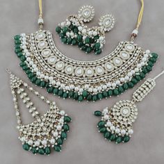 Designer elegant kundan necklace set handcrafted with premium kundans & cat eye beads > Premium quality kundan with back meenakari Inspired By  Wedding Kundan jewelry Such intricate detailing in this Inspired Heritage Royal Set with Green Emerald drops and Flawless Polki and Diamond work. This set will surely make heads turn .. Finest Kundan work . Shining Kundan Necklace With Earings And Tikka. For Wedding , Nikah , Sangeet , Baraat , For Bride. Thank You :) Kundan Jewelry For Wedding And Navratri, Kundan Jewelry With Stone Work For Navratri, Hand Set Kundan Necklace For Wedding And Navratri, Green Jewelry For Wedding And Navratri, Handmade Chandbali Kundan Bridal Necklace, Traditional Green Jewelry For Navratri, Green Cutdana Jewelry For Eid, Handmade Green Bridal Necklace For Wedding, Handmade Bollywood Kundan Jewelry Sets