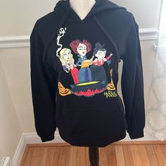 Disney Hocus Pocus Sanderson Sisters Black Hooded Sweatshirt/Hoodie. Size Medium. Nwt. Large Front Kangaroo Pocket. Drawstring At Hood. Chest Measures Approx 39 Inches. Length Measures Approx 26 Inches. Fleece Hooded Sweatshirt With Character Print, Hooded Fleece Sweatshirt With Character Print, Fan Merchandise Hooded Top With Drawstring Hood, Fall Fleece Hoodie With Character Print, Black Fleece Halloween Hoodie, Black Fleece Hoodie For Halloween, Disney Cotton Hoodie With Drawstring Hood, Black Disney Character Print Sweatshirt, Disney Cotton Hoodie With Drawstring