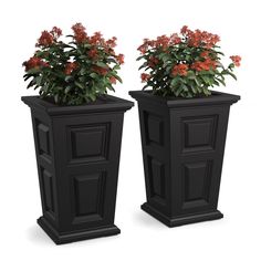 two black planters with red flowers in them on a white background, one is tall and the other is short