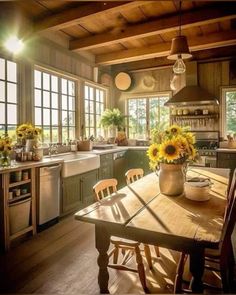 sunflowers are in a vase on the kitchen table next to an oven and sink