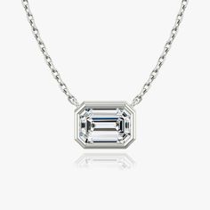 The Bezel Solitaire Necklace combines vintage-inspired detail and modern appeal together for a look that’s timelessly elegant. Classic Sterling Silver Necklace With Bezel Setting, Elegant Octagon Diamond Necklace, Timeless 14k Gold Emerald Cut Solitaire Necklace, Elegant Octagonal Diamond Necklace, Elegant Emerald Cut Diamond Necklace For Formal Events, Elegant Vvs Clarity Emerald Cut Diamond Necklace, Formal Platinum Necklace With Emerald Cut, Timeless Solitaire Necklace With Bezel Setting For Formal Occasions, Timeless Solitaire Necklace With Bezel Setting For Formal Events