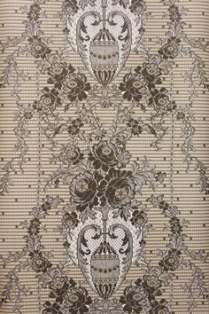 an intricately designed wallpaper with skulls and flowers in brown, beige and white