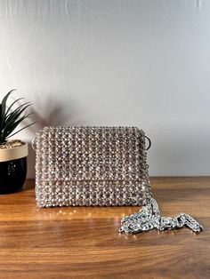 Dazzling nights call for an exquisite companion. This beaded evening bag adds the perfect touch of glamour to your ensemble. Dimension: Width: 18cm Height: 13cm Depth: 6cm The bag comes with two detachable handles. Feel free to contact me for any questions. Glamorous Beaded Bag For Events, Glamorous Beaded Bags For Events, Sparkling Evening Clutch Bag, Glamorous Beaded Clutch Evening Bag, Glamorous Party Shoulder Bag, Glamorous Beaded Evening Bag For Formal Occasions, Glamorous Beaded Evening Bag, Glamorous Beaded Evening Bag For Formal Events, Sparkling Rectangular Clutch For Party