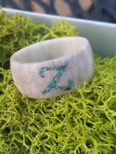 Antler Ring with monogram Turquoise Inlay.  Each ring is carved by hand. Due to the natural, handmade nature of antler rings, each ring is unique in the color and grain pattern of the ring. Rings are crafted from Illinois Whitetail Antler, which is naturally shed by the deer each year.   Any Single letter is available! Multiple letters are available by request for an extra charge, just ask me for a custom listing Antler Rings Women, Deer Horn Jewelry, Antler Rings, Bullet Casing Jewelry, Deer Antler Crafts, Antler Carving, Deer Antler Ring, Antler Earrings, Antler Crafts