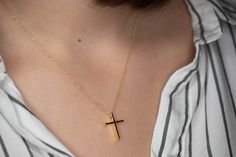 Minimal solid gold handmade cross necklace, unisex cross, great for men and women alike. Available in 14k yellow and 14k white gold, please make your choice from the drop down menu. This pendant has a shiny/polished finish. Size: 1,9 cm / 0.8 inches long and 1.5cm / 0,6 inches wide Material: 14k solid yellow gold, 14k solid white gold You can choose the charm with a 14k solid gold chain or without a chain. Perfect Birthday gift, Baptism gift or for any other special occasion. Comes in gift box. Minimalist Cross Pendant Necklace As Gift, Simple Yellow Gold Cross Necklace, Simple Cross Jewelry For Gifts, Minimalist Cross Pendant Jewelry Gift, Minimalist Yellow Gold Cross Necklace, Minimalist Crucifix Necklace As A Gift, Minimalist Crucifix Necklace For Gift, Simple Everyday Cross Jewelry, Minimalist Yellow Gold Cross Pendant Necklace