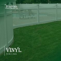 a white picket fence in front of a house