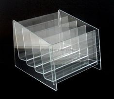 three tiered clear acrylic display case with dividers on each side and bottom