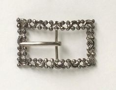 "Victorian Belt Buckle Cut Steel Antique This exquisite antique piece was designed as a victorian sash buckle. This piece is made up of two rows of faceted cut steel riveted beads in round and in moon shapes! The buckle is rectangular in shape with a large shiny metal center pin. This buckle was made in a bowed shape to fit the body. This piece is a true antique with wonderful and delicate craftsmanship! The steel has a natural dark grey patina. This wonderful piece is not marked but looks to be Victorian Belt, Antique Sewing Kit, Antique Belt Buckle, Steel Belt Buckle, Vintage Eye Glasses, Bling Belts, Silver Belt Buckle, Silver Belts, Brass Bracelet