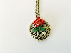 Inspired by Belles enchanted rose from Beauty and the Beast is a small brass filigree locket. The locket is 25mm and features a rose that I hand painted red with a green stem. It opens to the quote, 'until the last petal falls' The locket hangs on a lead and nickel free brass chain. You may select your preferred chain length at check out. Your locket will arrive to you beautifully packaged and ready for gifting. Until The Last Petal Falls, Rose Locket, Brass Filigree, Enchanted Rose, Rose Necklace, Keepsake Jewelry, Brass Chain, A Rose, The Beast