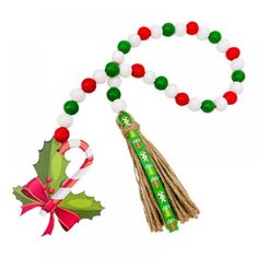 a green and white beaded necklace with candy canes on it, next to an ornament