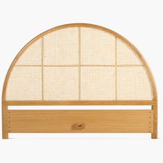 the headboard is made out of bamboo and has an arched design on it's sides