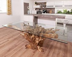 a wooden table with glass top in a room