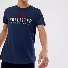 Nwt/ 100% Color: Navy Blue / Size: Small Hollister Co. / Men's Logo Graphic Tee Branded Blue Summer Tops, Summer Blue Tops With Branding, Navy Tops For Spring Streetwear, Casual Navy Shirt With Letter Print, Navy Cotton Graphic Tee Shirt, Navy Cotton Graphic Print Shirt, Navy Cotton Shirt With Graphic Print, Navy Cotton Shirt With Letter Print, Navy Cotton T-shirt For Spring