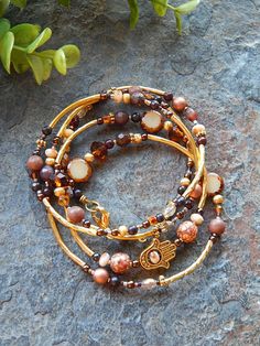 Brown and gold bracelet - beaded hamsa bracelet - long convertible necklace or wrap bracelet - layering jewelry - amber glass - earth tones Kalispell Mt, Convertible Necklace, Bracelet Layering, Autumn Jewelry, Layering Jewelry, Hamsa Bracelet, Bracelets Beaded, Good Karma, Wrap Bracelets