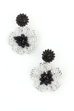 Black and white sequin and bead dangle earrings. Pierced Style Backing Black and White White Dangle Flower Earrings For Party, White Beaded Earrings For Spring Party, White Beaded Earrings For Spring, White Drop Flower Earrings For Party, White Flower Drop Earrings For Parties, White Flower Beaded Earrings For Spring, Elegant White Embellished Earrings, White Embellished Earrings For Party, White Flower Earrings For Evening