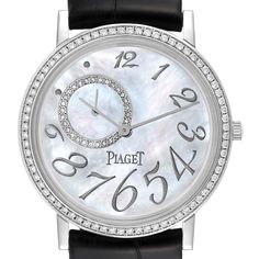 Piaget Altiplano Mother Of Pearl White Gold Diamond Mens Watch GOA31106. Manual winding movement. 18K white gold case 34.0 mm in diameter. Snap-on caseback. 18k white gold bezel set with original Piaget factory diamonds. Scratch resistant sapphire crystal. Mother of pearl dial with raised white gold Arabic numerals. Small seconds sub-dial between 9 and 12. Black leather strap with 18k white gold tang buckle. White Gold Diamond Watch With Skeleton Dial, Anniversary White Gold Watches With Skeleton Dial, Classic Round Diamond Watch With Skeleton Dial, Classic Diamond Watch With Skeleton Dial, Round Diamond Watch With Diamond Hour Markers For Business, Business Diamond Watch With Round Shape, Business Diamond Watch With Round Face, Business Diamond Watch With Hour Markers, White Diamond Chronometer Watch