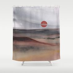 a shower curtain with an image of a sunset in the distance and clouds above it