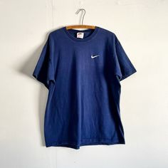 Just a nice simple swoosh navy blue faded Nike shirt. No major flaws, worn in. Measurements and details in photos. Cheap Navy Nike Tops, Nike Casual Blue Shirt, Tee Shirt Nike Bleu, Nike Bleu, Nike Blue Graphic Tee, Casual Blue Nike T-shirt, Blue Vintage Nike Sweatshirt, Affordable Blue Nike T-shirt, Nike Navy Sports T-shirt