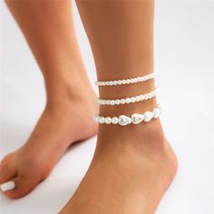 Discover Bohemian Elegance Step into the sun-drenched season with a touch of elegance and a sprinkle of Bohemian charm. Our Boho Chic Multi-Layer Pearl Anklet transforms any summer look, from beachwear to evening gowns, into a statement of style and sophistication. Crafted with delicate simulated pearls, this anklet is designed to captivate and charm at every turn. Exquisite Craftsmanship Each anklet is meticulously assembled with high-quality simulated pearls, featuring a white color that gleam Anklet For Women, Summer Anklets, Pearl Anklet, Foot Jewelry, Ankle Bracelet, Chain Anklet, Pearl Chain, Ankle Bracelets, Sandals Summer