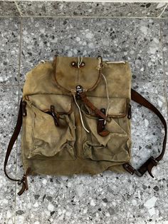 Very Old Genuine Military Bag Haversack Backpack Vintage Canvas Army Canvas Leather Straps Unisex 1970 Haversack Vintage Canvas Army Size 41 Centimetres (16 inches) / 40 Centimetres (16 inches) Bag Strong Durable military canvas For professional use  One size fits all Unisex Check photos for condition Vintage Satchel Backpack With Large Capacity, Vintage Large Capacity Standard Backpack, Vintage Satchel Backpack For Daily Use, Vintage Travel Backpack With Adjustable Strap, Backpack With Pockets For Outdoor Activities, Vintage Satchel Backpack With Adjustable Strap, Outdoor Activity Backpack With Pockets, Vintage Backpack With Adjustable Strap For Adventure, Vintage Backpack-style Shoulder Bag For Travel