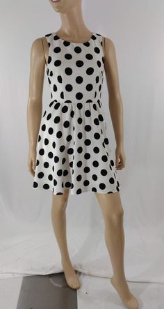 "Women's Dress Black White Polka Dot Classic Vintage by ALYA SIZE S Black and white LARGE polka dots sleeveless pull over dress with scoop neck. High quality. Excellent like new condition. Easy to wear casual chic vintage for the disco sporting life. MEASUREMENTS: Length - 32.5\" Bust (underarms to underarms) - 33-36\" Waist - 27\"unstretched Hips -22\"x2 MODEL STATS: Ht. - 5' 8.5\" Bust - 34\" Waist - 25\" Hips - 35\" *Please check measurements to ensure proper fit and remember to allow extra r Sleeveless Polka Dot Mini Dress, Polka Dot Sleeveless Mini Dress, Polka Dot Sleeveless Lined Dress, Casual Polka Dot Sleeveless Party Dress, Casual Polka Dot Sleeveless Dress For Party, Fitted Polka Dot Sleeveless Dress For Spring, Fitted Polka Dot Sleeveless Casual Dress, Fitted Casual Sleeveless Polka Dot Dress, Casual Fitted Sleeveless Polka Dot Dress