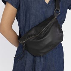 "a Beautiful fanny pack bag in a medium size, Made from soft premium Italian leather in Black color. perfect as your daily small bag for hands-free carrying, This accessory makes hearts skip a beat. a fashion forward bag that's trendy, unisex and functional ◄ DIMENSIONS ► Height: 28 cm / 11\" Width: 20 cm / 7.8\" Features► * Adjustable crossbody / waist strap * Fully lined * 1 inside zippered pocket * 1 Outer zippered pocket * YKK Metal zip closure . VISIT THE REST OF THE SHOP ► www.etsy.com/sho Modern Leather Belt Bag With Zipper Pouch, Modern Soft Leather Pouch Belt Bag, Soft Leather Belt Bag Pouch For Travel, Soft Leather Pouch Chest Bag, Everyday Soft Leather Pouch Belt Bag, Versatile Soft Leather Pouch Belt Bag, Everyday Soft Leather Pouch Chest Bag, Soft Leather Pouch, Belt Bag For Women