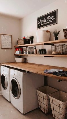 a washer and dryer in a laundry room with shelves above the washer