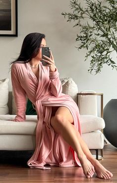 About This Robe: The So Blush Robe is an elegant and soft shade of pink. Our original Pink Sugar Short robe now in a long version. Details True to Size, does not run small Size up for a more relaxed fit Please try our Swan AI phone scan to find your ideal size under the color tabs Model is wearing size XS (Measurements: 5'3/115 lbs/(34DD/24/36) 95% Poly/5% Spandex Inside ties 54" long 2 Pockets Comes packaged in a beautiful pink satin bag Bedroom Robes, Fuzzy Robe, 115 Lbs, Shade Of Pink, Ideal Wardrobe, Satin Bags, Women's Robe, Pink Sugar, Pink Satin