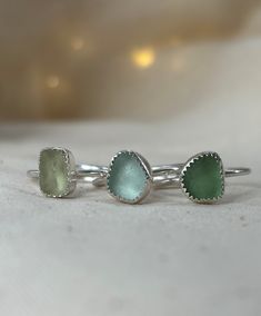 Fits sizes UK L-Q, US 6-8 Beautiful and super vibrant sea glass and sterling silver are the best combinations! Adjustable rings are a perfect gift idea so order one today as each ring fits the most common sizes! MATERIALS I use the best quality Sterling Silver, which doesn't contain harmful lead or nickel and is suitable for sensitive skin. Only recycled silver is used! Seaglass from Seaham, UK.  OPTIONS Adjustable Sterling Silver rings with Sea Glass - 6 rings are available, each fits sizes UK L-Q, US 6-8. Double-check the picture and colour before ordering the ring. PACKAGING Is it a gift for someone special ? No problem! Each product comes in the jewellery box. Orders can be sent directly to recipients by using their address at checkout. DELIVERY Delivery typically takes: - UK: 1-2 busi Adjustable Sea Glass Ring Jewelry, Adjustable Silver Ring With Sea Glass, Handmade Sea Glass Ring Jewelry, Silver Recycled Glass Ring, Handmade Adjustable Sea Glass Rings, Silver Sea Glass Ring For Beach, Sea Glass Bridesmaid, Sea Glass Rings, Ring Packaging