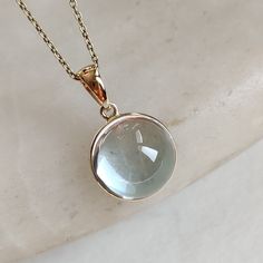 This stunning Pendant is set in 14k Solid Yellow Gold with Natural Sky Blue Topaz with utmost precision. It is a unique gemstone Pendant for nearly every occasion and is completely hassle-free jewelry. ITEM DETAILS: * GEM: Sky Blue Topaz * GEM SIZE: 13x13mm * GEM SHAPE: Round * Gem weight: 9.45 carats * Gold Purity: 14KT (58.33% approx.) * Gold Weight: 0.48 gram * Total Weight of the Pendant: 2.37 gram The Gold purity is guaranteed and it comes with authentic 14KT gold hallmark. Since my items are handmade, they are absolutely nickel and lead free. CUSTOMIZATION: * Gemstone customization is available and it can be substituted with a gem of your choice. Kindly message me for the same. PACKAGING * The Pendant comes with layers of safe and secure wrapping along with Free handmade jewelry box Topaz Pendant Necklace For Gifting, Gold Blue Topaz Pendant Jewelry, Yellow Gold Blue Topaz Pendant Jewelry, Blue Topaz Pendant Necklace, Gold Skies, Handmade Jewelry Box, Blue Topaz Jewelry, Blue Topaz Pendant, Topaz Pendant