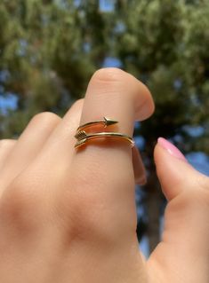 This adjustable dainty arrow ring can serve as a reminder that when it comes to dreams, aim high. Wear it as a statement or stack it up to create a look that's truly yours. Made with 14K Gold. Style: Stackable Sideways Arrow Ring Metal: 14K Yellow Gold, 14K White Gold Ring Size: Made in your size Arow Ring, Goddess Aesthetics, Adjustable Arrow Jewelry As Gift, Bow And Arrow Ring, Sagittarius Aesthetic, Arrow Rings Silver, Bow And Arrow Necklace, Bow And Arrow Pendant, Arrow Jewelry