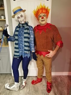 two people in costumes standing next to each other