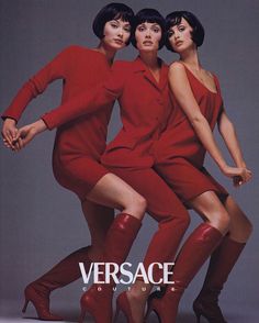 three women in red dresses and high heeled boots are posing for the cover of versa magazine