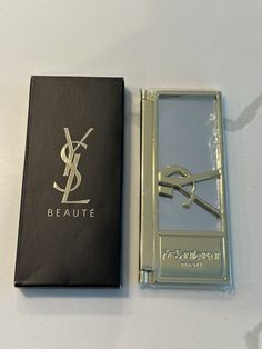 Brand New YSL Logo Mirror from Yves Saint Laurent Beauté.   Comes in black box.  Width 3.75" x Height 1.75"  Perfect to show off to all your friends that you have a rare YSL Mirror from the Yves Saint Laurent Beauty Collection. Logo Mirror, Logo Beauty, Ysl Beauty, Ysl Logo, Makeup Mirrors, Beauty Logo, Beauty Collection, Compact Mirror, Black Box