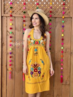 This Beautiful Halter Dress boasts a Traditional Mexican floral design combined with a modern style dress. It's made out of fine Mexican cotton, has ties around the neck and has elastic on the back for a tighter fit. It has hand embroidered flowers and hand knit details throughout. This dress is handmade by Mexican Artisans in Mexico. Note: Since this dress is Hand embroidered the embroidered colors on each dress vary, making them one of a kind. Mexican Party Dress, Mexican Bridesmaid Dresses, Mexican Dress, Floral Halter Dress, Hand Embroidered Flowers, Mexican Party, Traditional Mexican, Mexican Dresses, Flower Tops