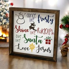 a framed sign that says dance like frosty shine like rudolph give santa love jesus