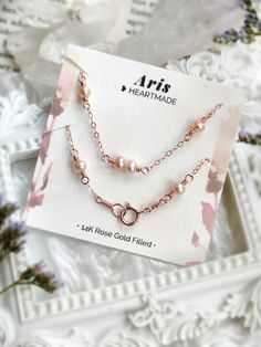 💗 Rose Gold Pearl Bracelet with pink freshwater pearls & 14K Rose Gold Filled 💗 ✨ Dainty & Elegant. Simply beautiful bridal bracelet. A perfect gift for bridesmaids & affordable treat for yourself. • Pearl size: 4-5 mm • Handmade with genuine pink Freshwater Pearls. All metal parts are high-quality 14K Rose Gold Filled. It also can be made with 14K Gold-filled or Sterling Silver. • 14K gold-filled chain is known for its lasting quality. The jewelry will last for decades and is considered a lif Rose Gold Bracelet With Pearl Charm For Gift, Rose Gold Bracelet With Pearl Charm As Gift, Rose Gold Bracelet With Pearl Charm, Elegant Pearl Bracelet For Valentine's Day, Elegant Rose Colored Bracelet, Pink Pearl Bracelet For Wedding, Elegant Pink Gold Bracelets For Wedding, Delicate Rose Gold Pearl Bracelet, Elegant Bracelets For Bridesmaid Gift On Valentine's Day