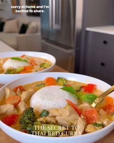 two white bowls filled with chicken and vegetables