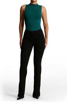 Sleek all-in-one style and breathable stretch jersey makes this thong bodysuit a svelte option for all your warm-weather plans. This form-fitting essential is made from the label's signature NW fabric, which is double lined, has four-way stretch, comfortable compression and a subtle crepe texture. Snap closure Funnel neck Sleeveless Lined 95% viscose, 5% elastane Hand wash, line dry Imported Stretch Bodysuit With Built-in Bra, Basic Fitted Bottoms For Loungewear, Basic Fitted Loungewear Bottoms, Stretch Bodysuit With Lined Body For Loungewear, Casual Elastane Lined Bodysuit, Sleek Stretch Bodysuit For Loungewear, Casual Stretch Bodysuit With Lined Body, Flattering Stretch Bottoms For Night Out, Casual Fitted Seamless Bodysuit