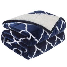 the blue and white blanket is folded on top of each other, with an animal print pattern