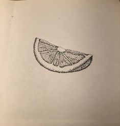 a drawing of a slice of orange on top of a piece of paper