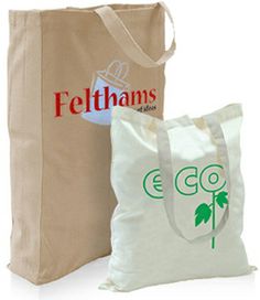 two bags with logos on them sitting next to each other in front of a bag