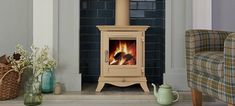 a wood burning stove sitting inside of a living room