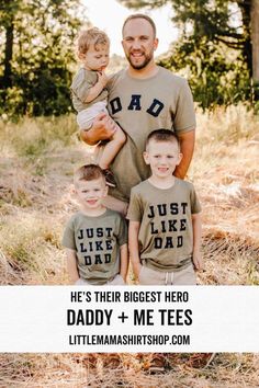 a man and two boys are posing for a photo with the words, he's their biggest hero daddy + me tees